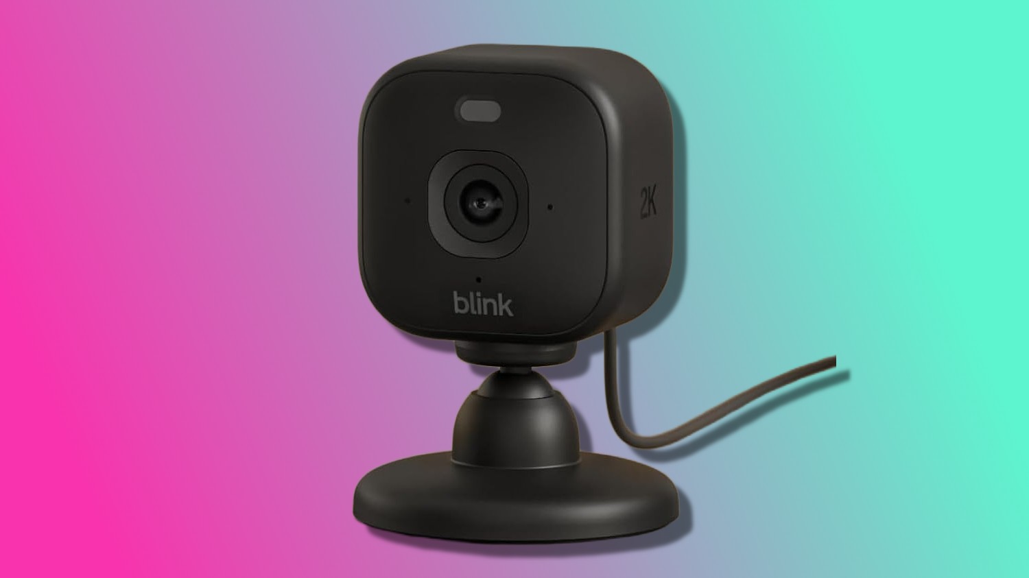 Blink Mini 2K camera with pink and blue background